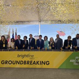 Congressmembers Norma Torres and Pete Aguilar, Nevada Representatives, Wes Edens of Brightline, and labor groups join U.S. Department of Transportation Secretary Buttigieg in hammering of spikes to commemorate the Brightline West Las Vegas groundbreaking.