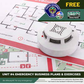 Smoke alarm sitting on top of house plan